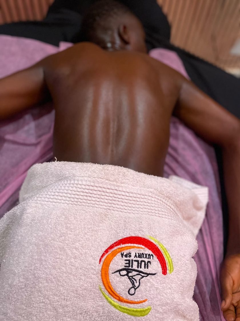 Julie Luxury Spa branded towel on the massage table